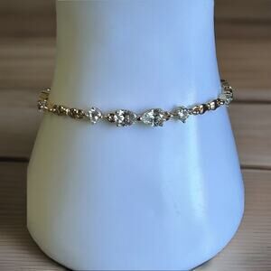 Beautiful Gold Tone Tennis Bracelet. Measures 7"